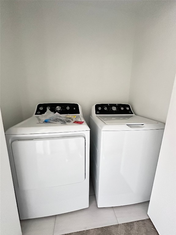 1830 River Crossing Circle, Unit C Austin, TX 78741 - Photo 8 of 16 a utility room with dryer and washer