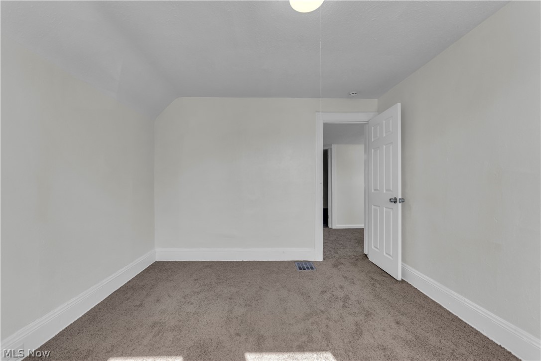 12905 Watterson Avenue Cleveland, OH 44105 - Photo 14 of 30 Unfurnished room featuring carpet floors and baseboards