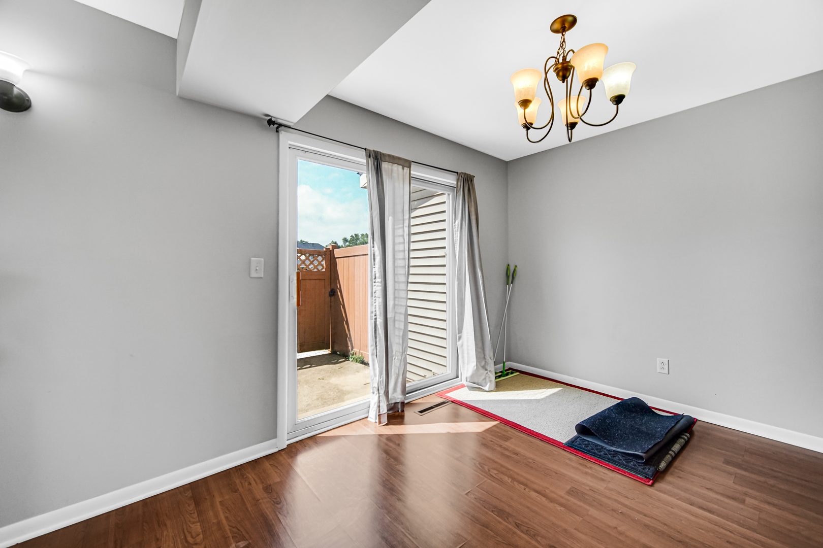601 Northgate Road, Unit 601 New Lenox, IL 60451 - Photo 12 of 21 an empty room with wooden floor and windows