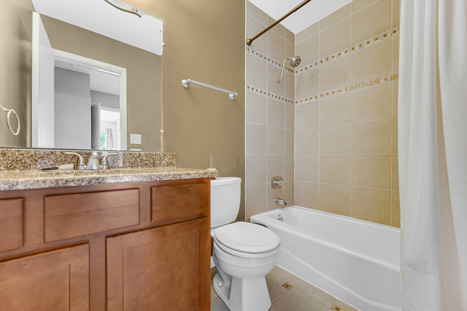 601 Northgate Road, Unit 601 New Lenox, IL 60451 - Photo 15 of 21 a bathroom with a granite countertop sink toilet and shower