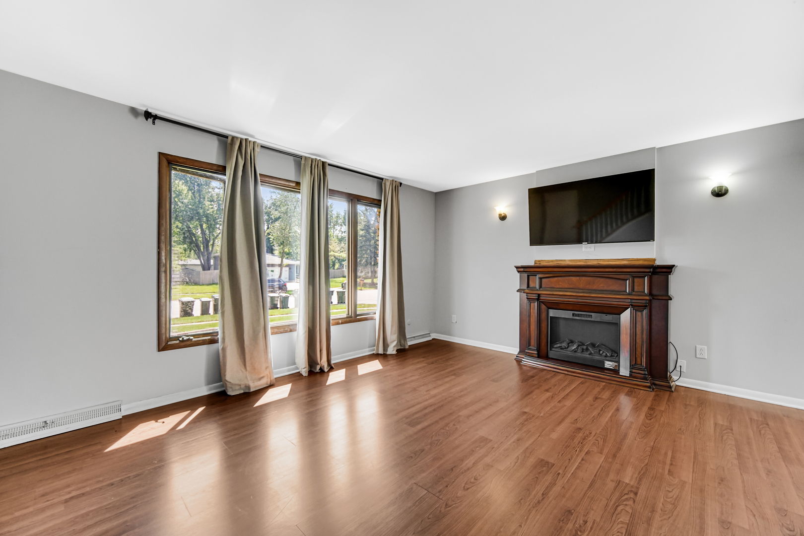 601 Northgate Road, Unit 601 New Lenox, IL 60451 - Photo 6 of 21 wooden floor fireplace and windows in an empty room