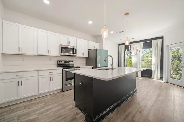 a bathroom with a granite countertop sink mirror and