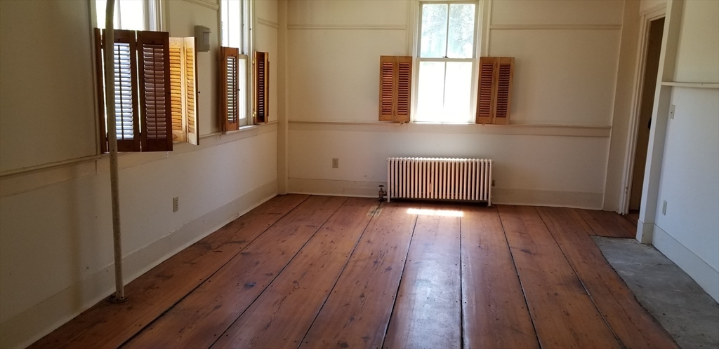 16 Amherst Road Pelham, MA 01002 - Photo 4 of 17 a view of wooden floor and windows in a room