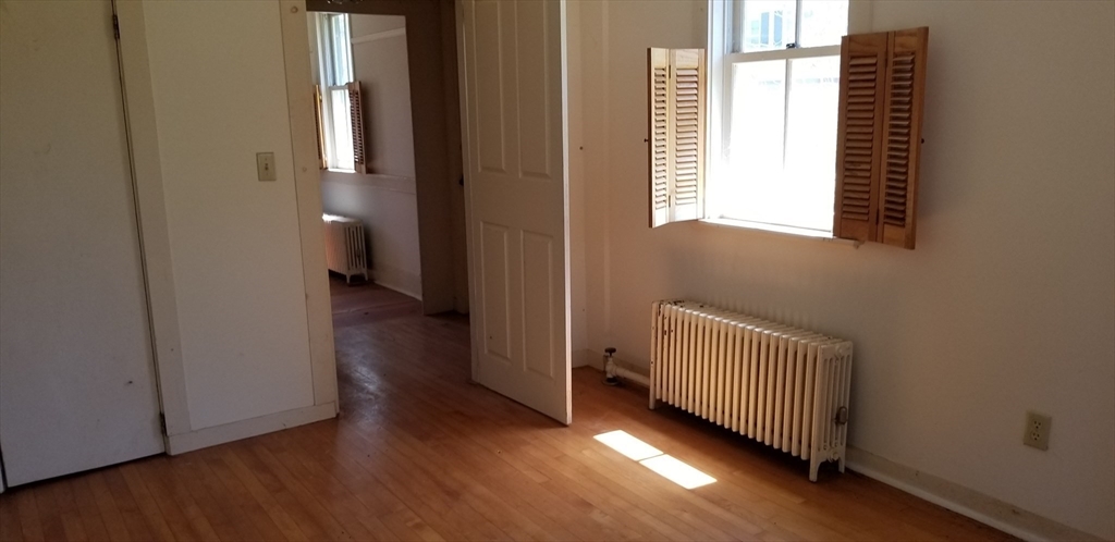16 Amherst Road Pelham, MA 01002 - Photo 6 of 17 a view of a room with wooden floor and windows