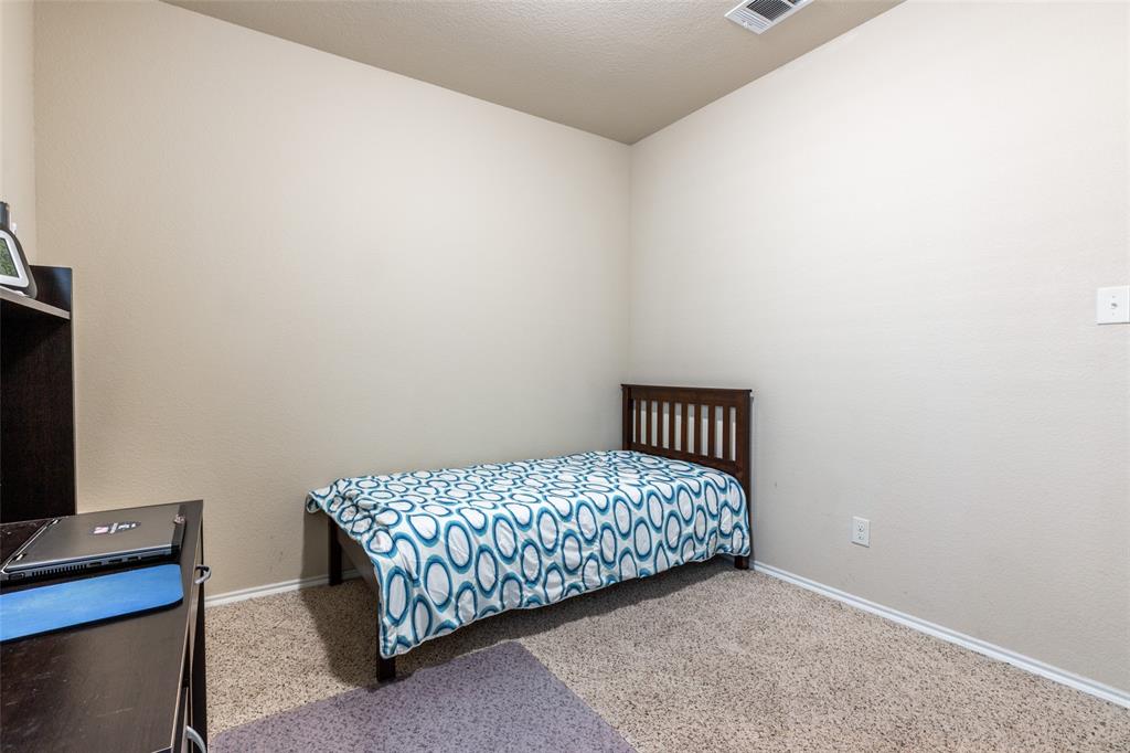504 Rocky Pine Road McKinney, TX 75072 - Photo 30 of 36 Carpeted bedroom with baseboards