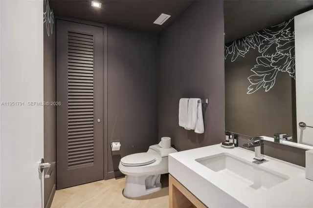 a bathroom with a sink and a toilet