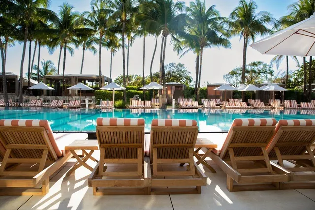 a view of outdoor space with seating area and swimming pool