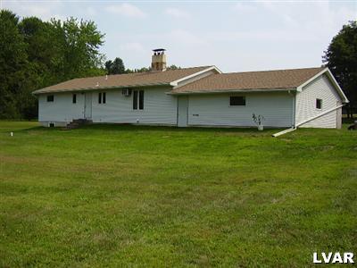 197 Belfast Road Wind Gap, PA 18091 - Photo 3 of 14 a front view of a house with garden