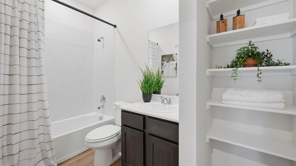 3435 Spur Run Sherman, TX 75090 - Photo 1 of 38 a bathroom with a sink a toilet and shower