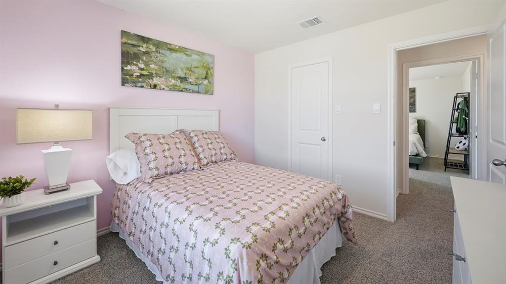 3435 Spur Run Sherman, TX 75090 - Photo 13 of 38 a bedroom with a bed and a lamp on dresser