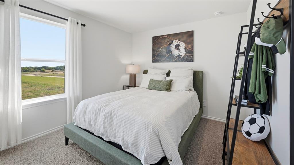 3435 Spur Run Sherman, TX 75090 - Photo 15 of 38 a bedroom with a bed and a window