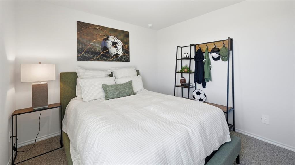 3435 Spur Run Sherman, TX 75090 - Photo 16 of 38 a bedroom with a bed and a painting on the wall