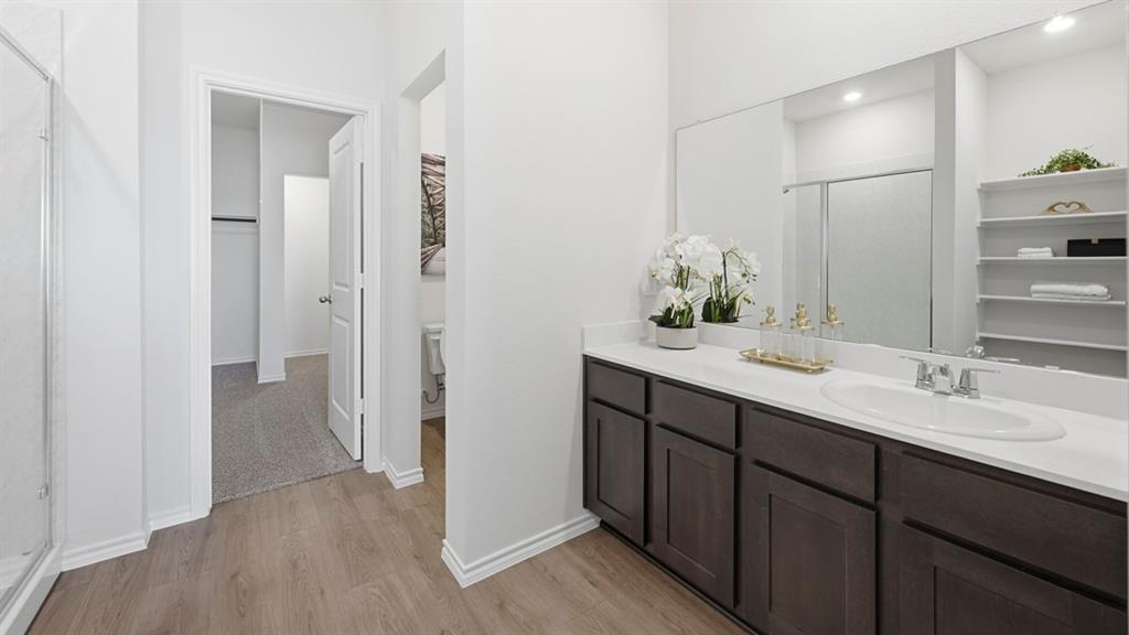 3435 Spur Run Sherman, TX 75090 - Photo 2 of 38 a bathroom with a double vanity sink and mirror