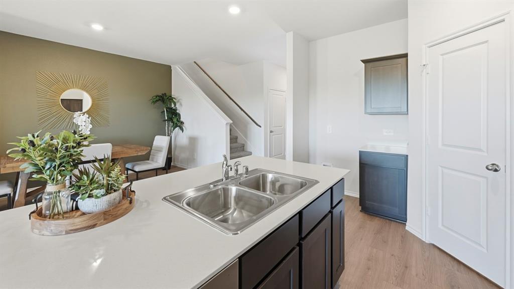 3435 Spur Run Sherman, TX 75090 - Photo 22 of 38 a kitchen with sink and mirror