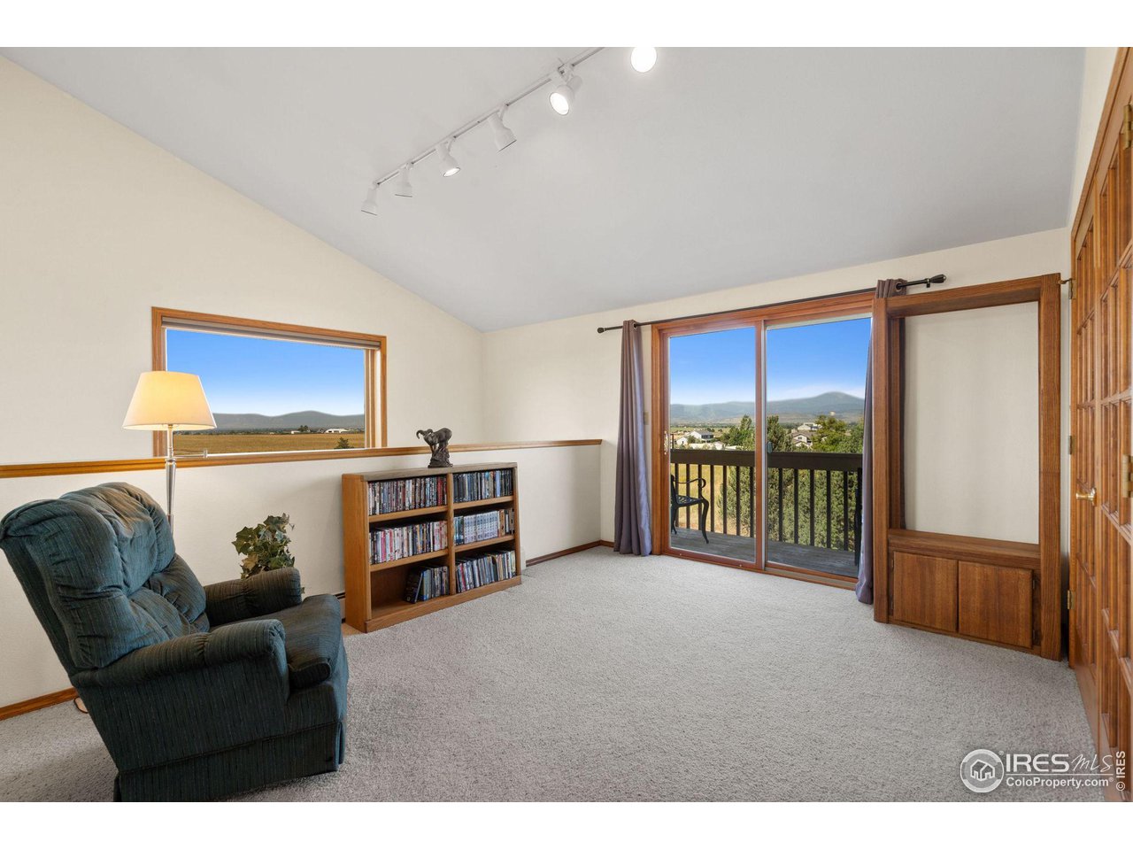 12492 Wasatch Road Longmont, CO 80504 - Photo 11 of 35 a living room with furniture and a window
