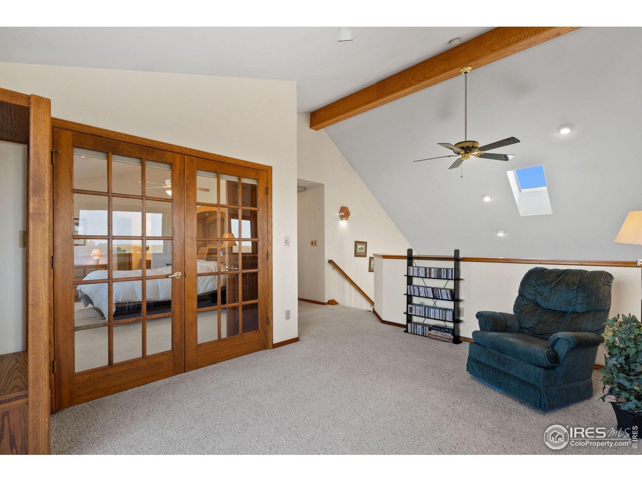 12492 Wasatch Road Longmont, CO 80504 - Photo 13 of 35 a living room with furniture and a ceiling fan