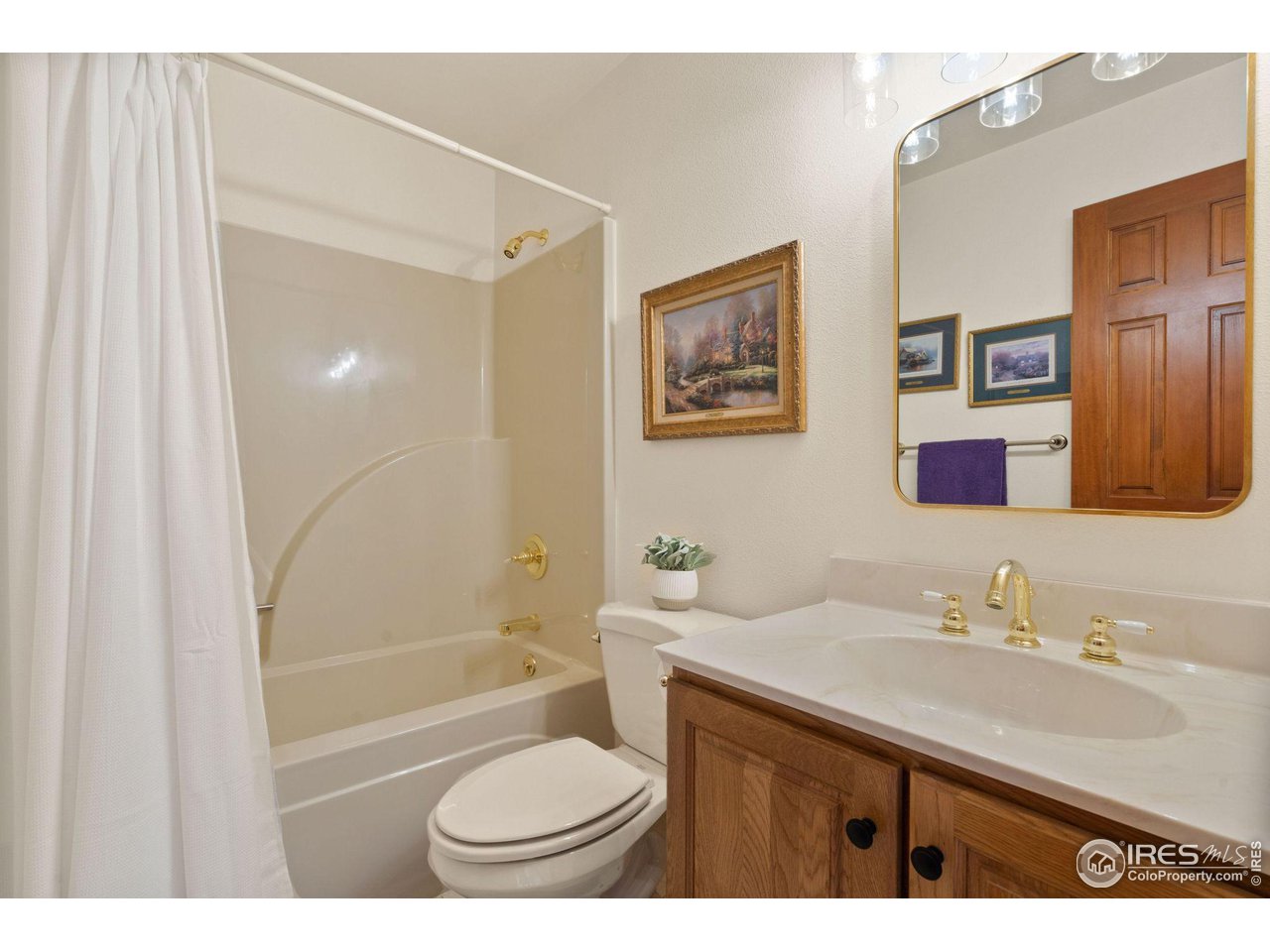 12492 Wasatch Road Longmont, CO 80504 - Photo 20 of 35 a bathroom with a sink a toilet and shower