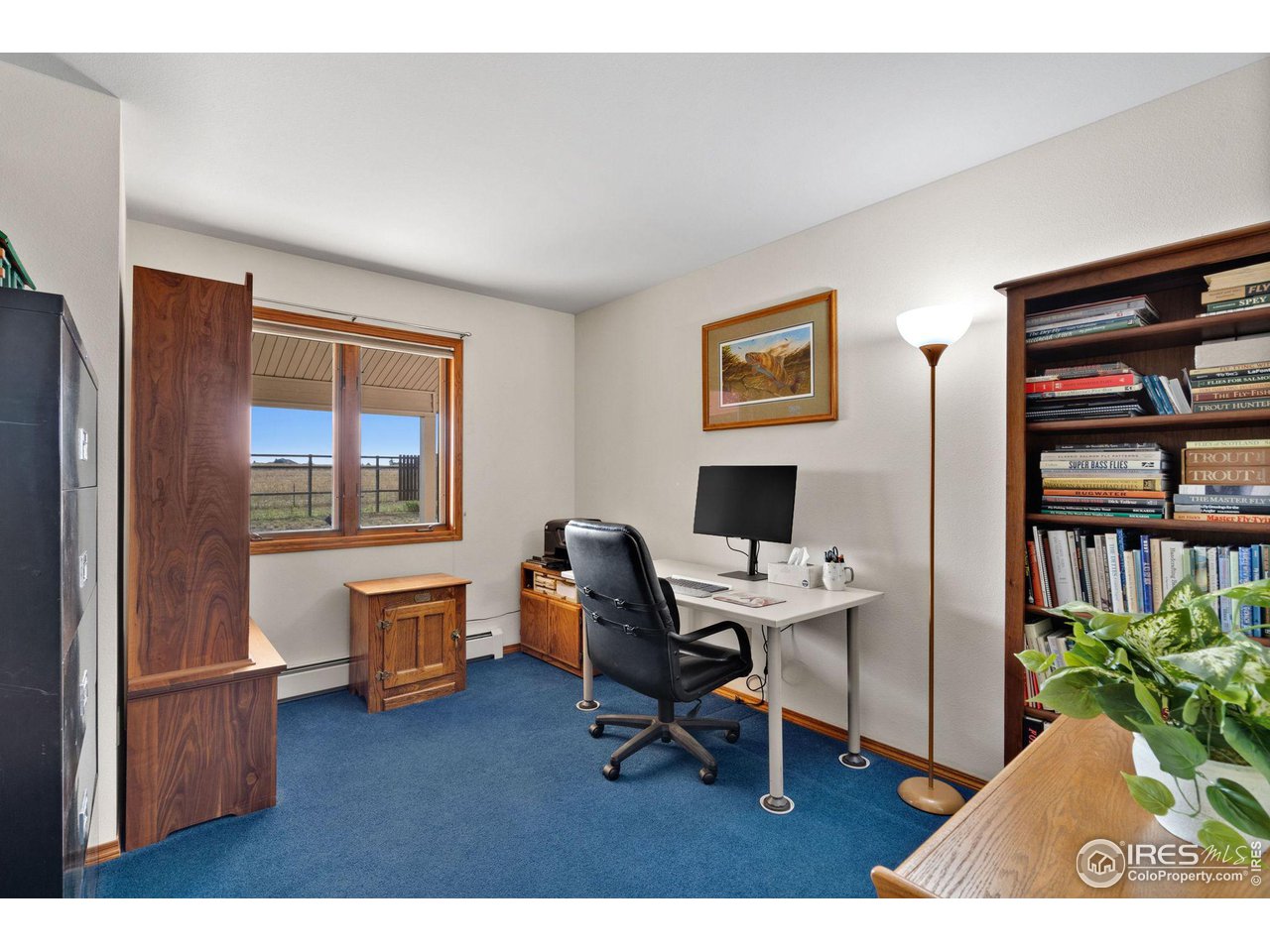 12492 Wasatch Road Longmont, CO 80504 - Photo 21 of 35 a workspace with furniture hardwood and a window