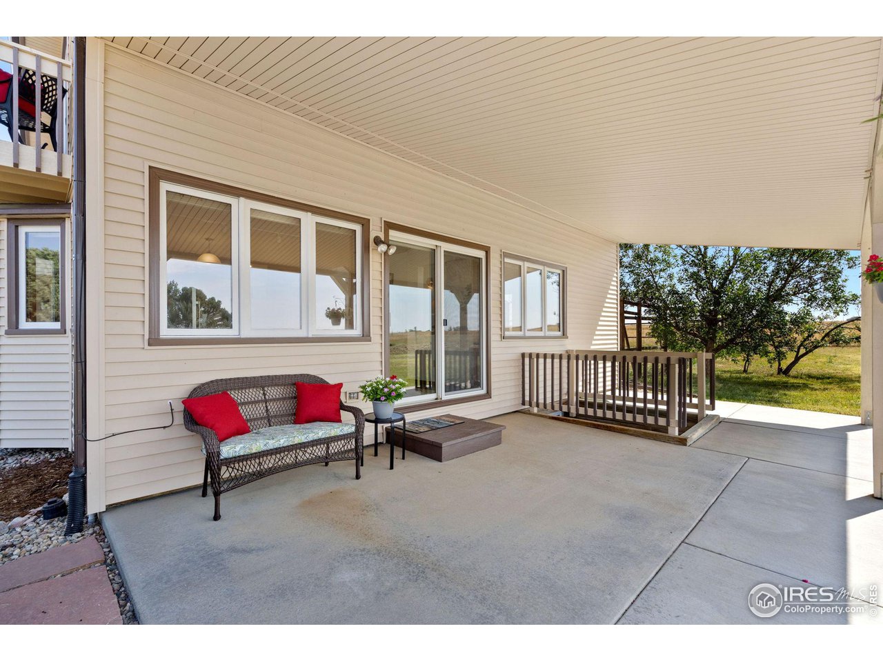 12492 Wasatch Road Longmont, CO 80504 - Photo 26 of 35 a backyard of a house with outdoor seating