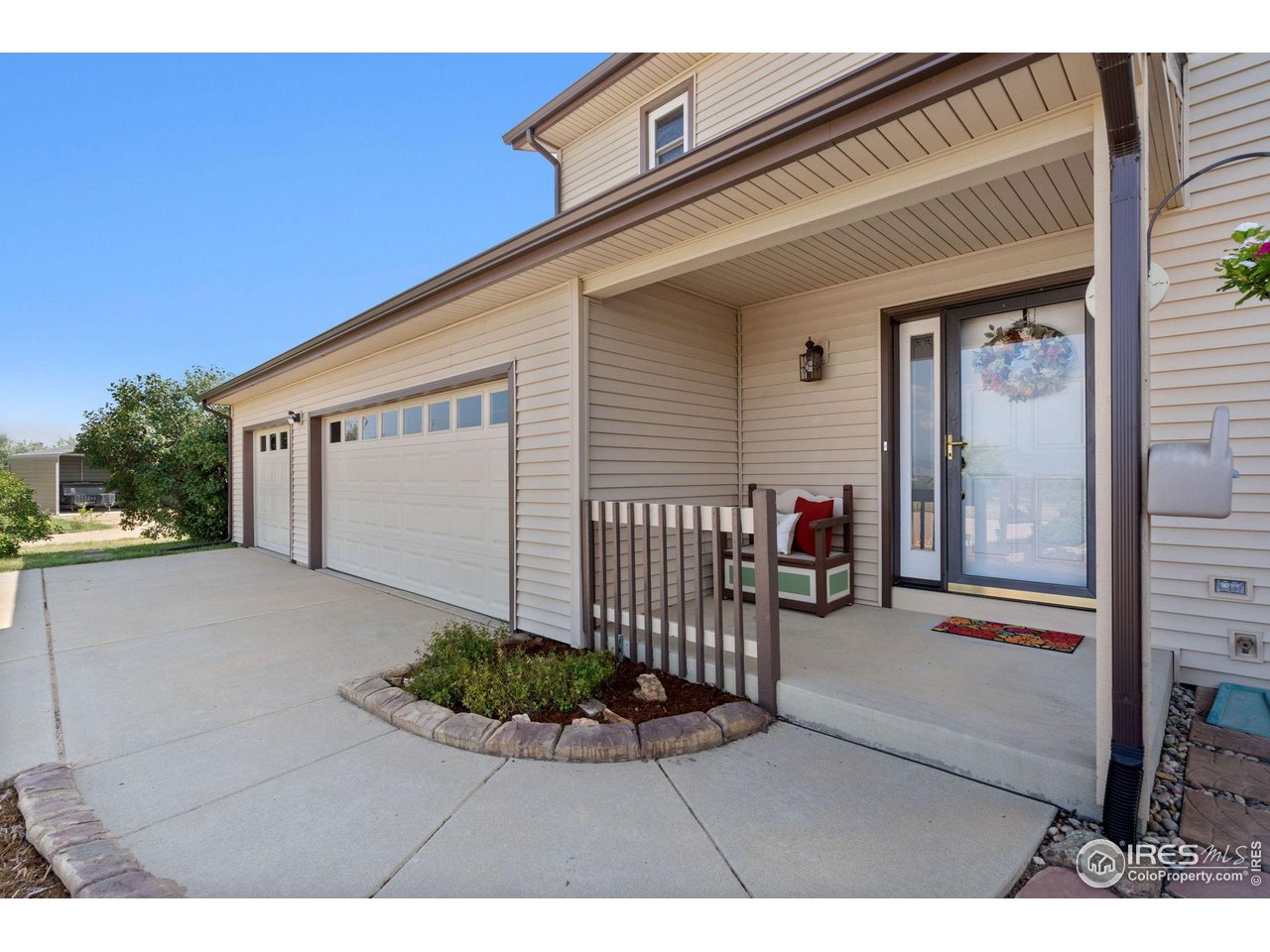12492 Wasatch Road Longmont, CO 80504 - Photo 4 of 35 a view of a porch with a bench