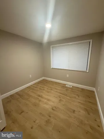 an empty room with a empty space and window