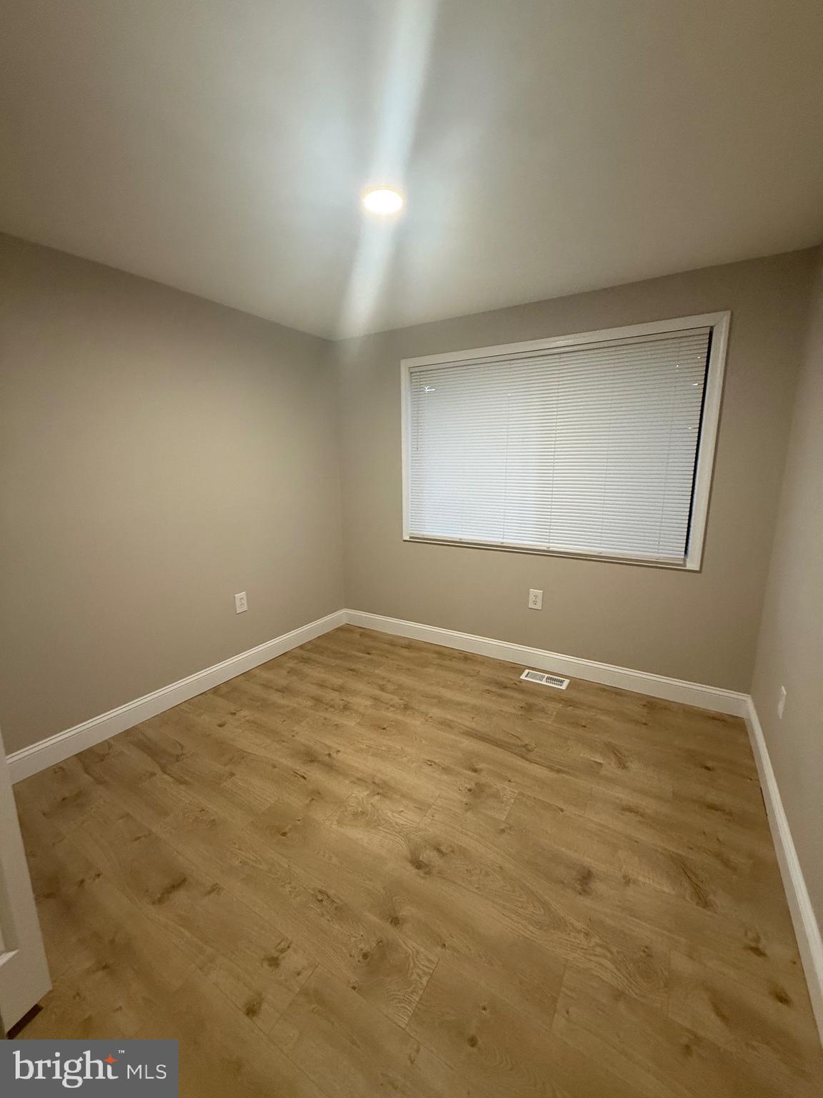 9524 Kilimanjaro Road Columbia, MD 21045 - Photo 4 of 11 an empty room with a empty space and window