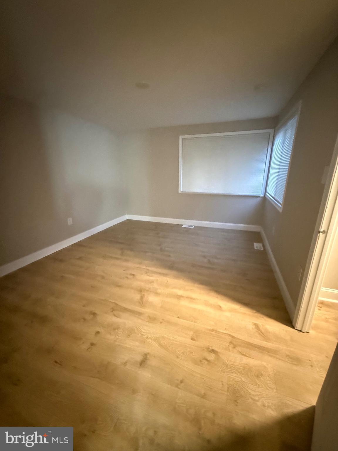 9524 Kilimanjaro Road Columbia, MD 21045 - Photo 7 of 11 a view of empty room with wooden floor
