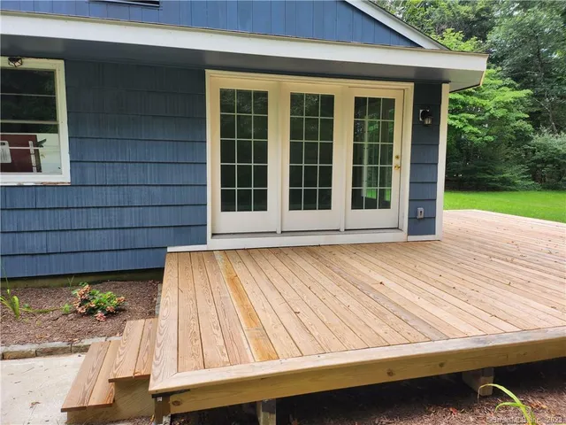 a view of wooden house with a swimming pool