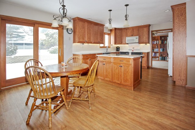 7417 East Maize Road Ridott, IL 61067 - Photo 13 of 46 a view of a dining room with furniture window and wooden floor