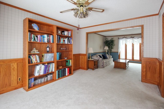 7417 East Maize Road Ridott, IL 61067 - Photo 17 of 46 a very nice looking room with a large window and a chandelier