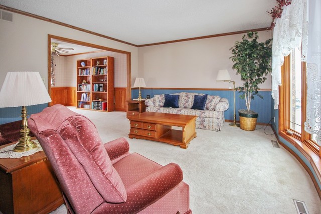 7417 East Maize Road Ridott, IL 61067 - Photo 19 of 46 a living room with furniture and a window