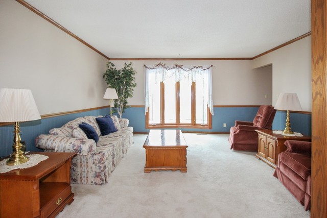 7417 East Maize Road Ridott, IL 61067 - Photo 20 of 46 a living room with furniture and a large window