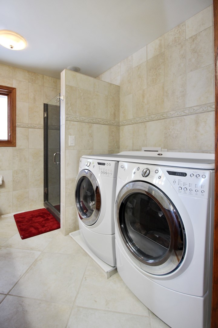 7417 East Maize Road Ridott, IL 61067 - Photo 28 of 46 a utility room with dryer and washer