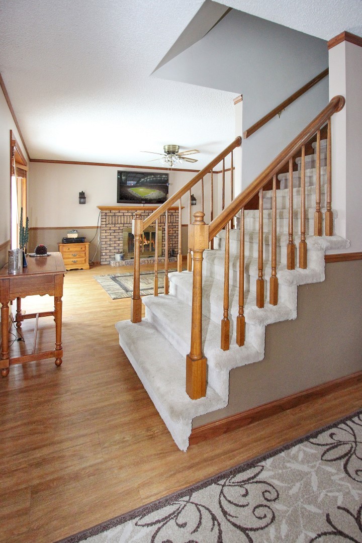 7417 East Maize Road Ridott, IL 61067 - Photo 4 of 46 a view of entryway and hall with wooden floor