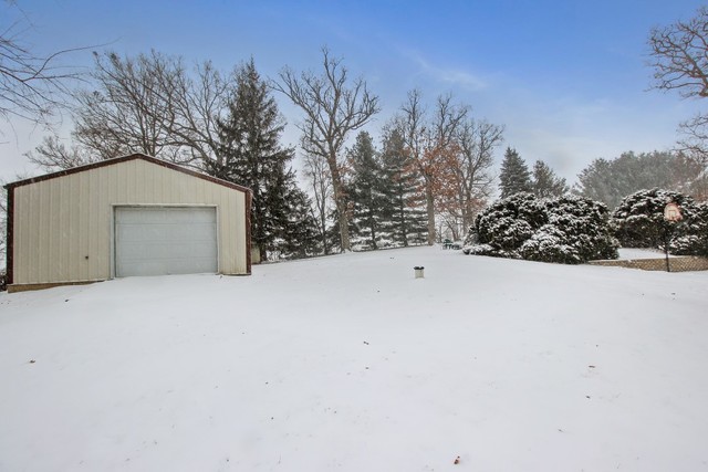 7417 East Maize Road Ridott, IL 61067 - Photo 5 of 46 a view of large house with a outdoor space
