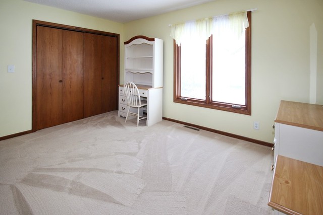 7417 East Maize Road Ridott, IL 61067 - Photo 41 of 46 a view of an empty room with a window