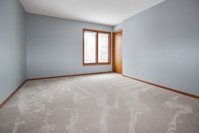 7417 East Maize Road Ridott, IL 61067 - Photo 42 of 46 a view of an empty room with a window