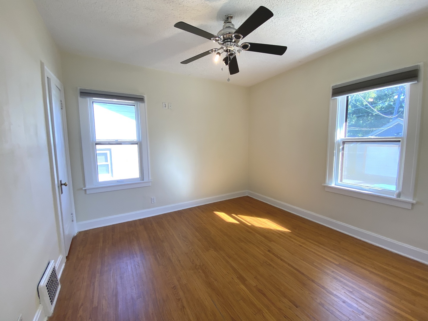 608 North Reed Street Joliet, IL 60435 - Photo 14 of 33 a view of empty room with wooden floor and fan