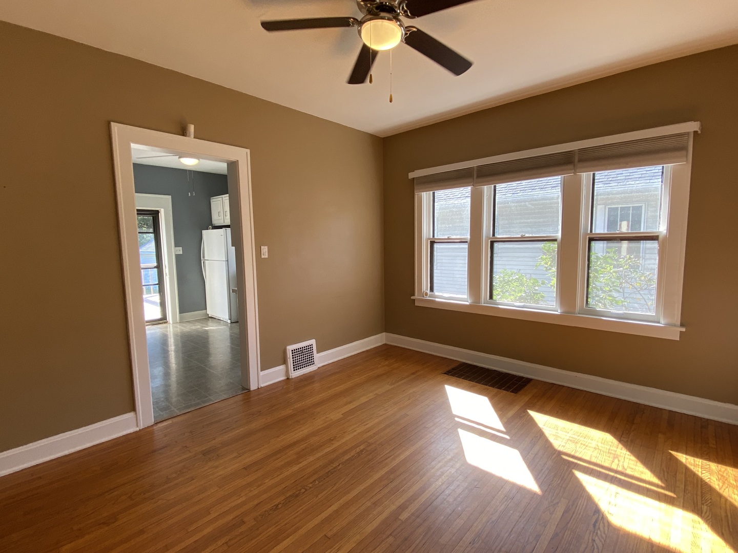 608 North Reed Street Joliet, IL 60435 - Photo 4 of 33 a view of empty room with wooden floor and fan