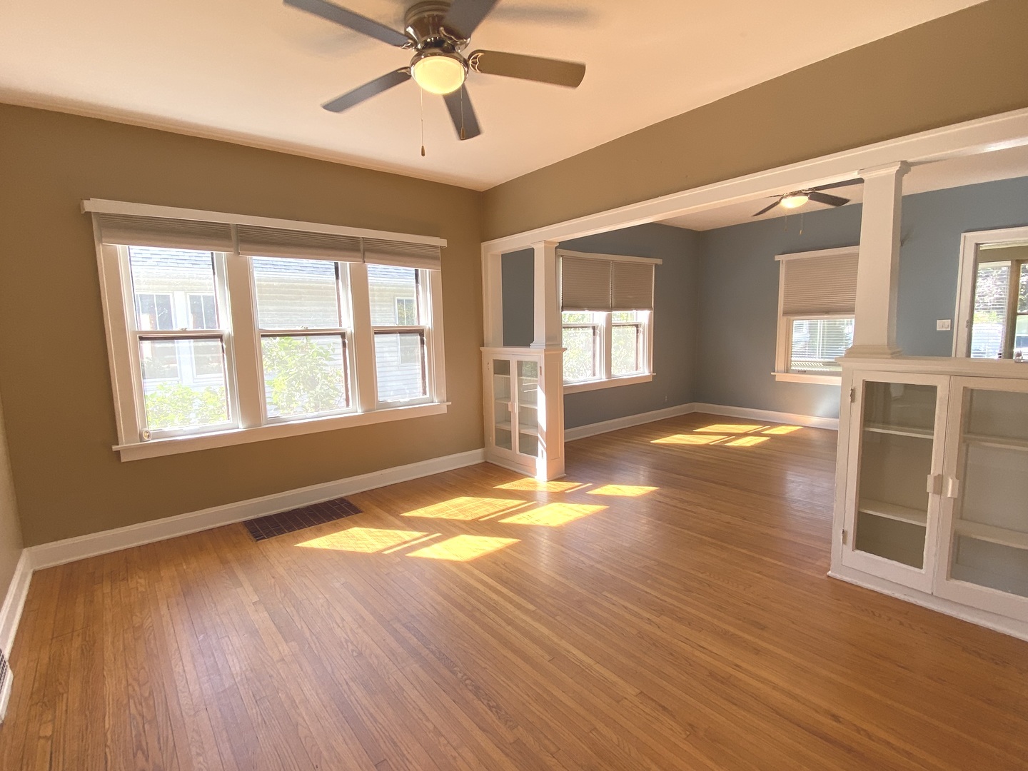 608 North Reed Street Joliet, IL 60435 - Photo 5 of 33 a view of an empty room with window and wooden floor