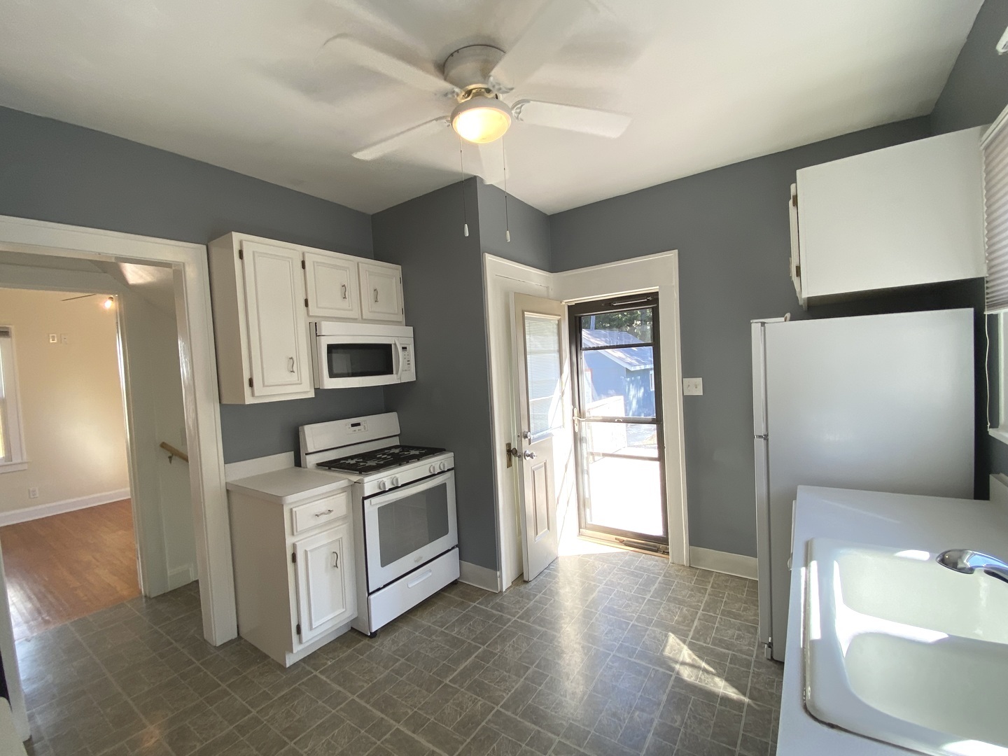608 North Reed Street Joliet, IL 60435 - Photo 10 of 33 a kitchen with stainless steel appliances granite countertop a refrigerator a stove and a sink with granite countertops