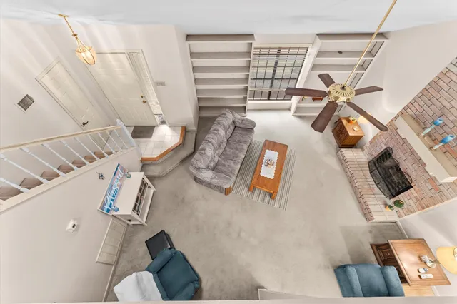 a view of living room with furniture and a window