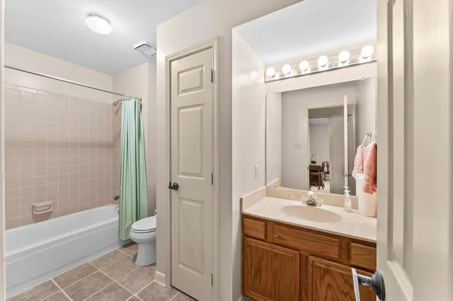 a dining room with furniture and a chandelier