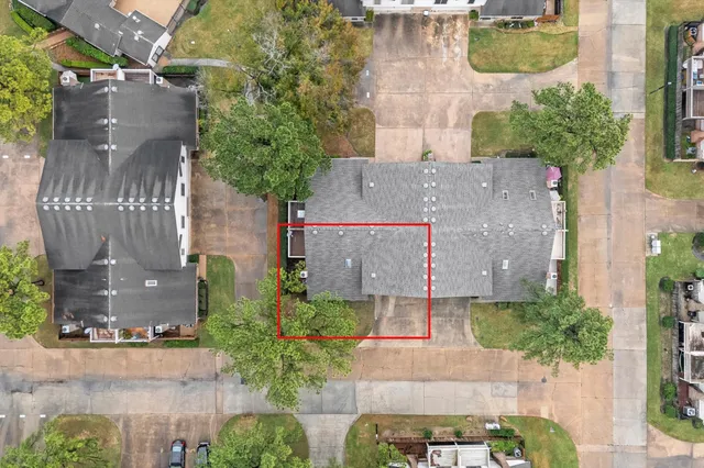 an aerial view of a house with a swimming pool