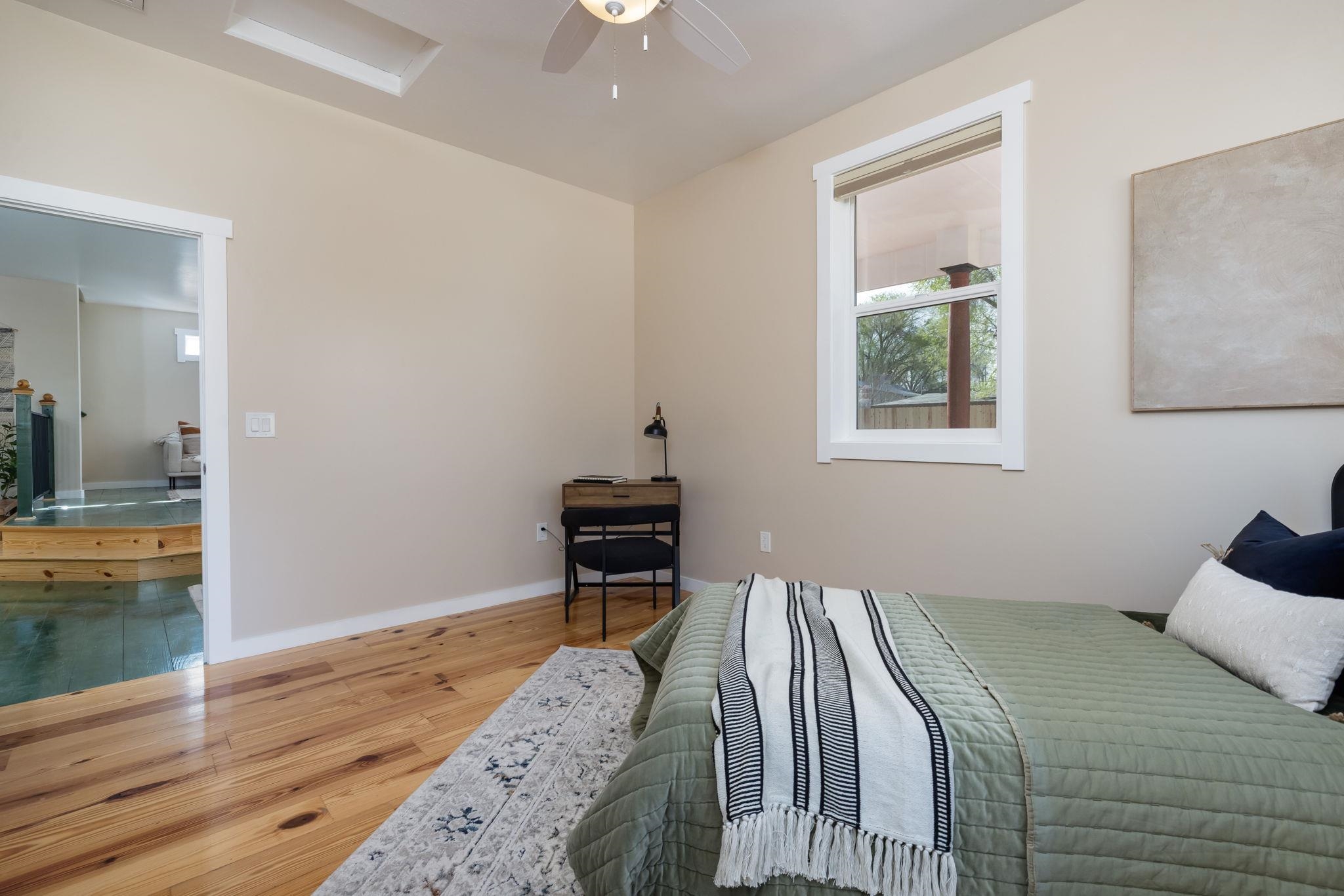 2877 B Road Grand Junction, CO 81503 - Photo 3 of 36 a bedroom with a bed and a chandelier