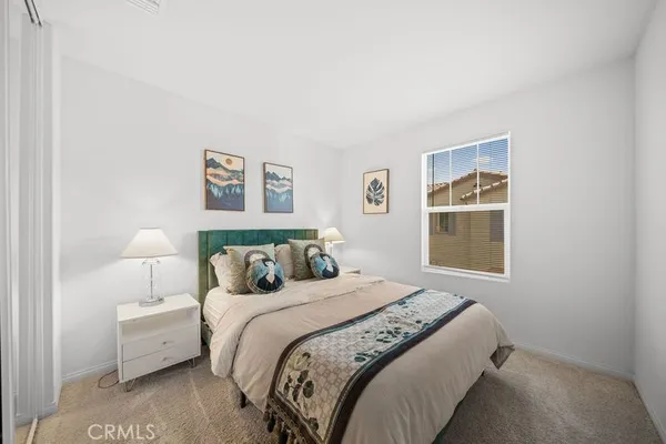 a bed room with a bed and a window