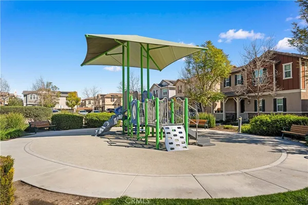 a front view of a house with swimming pool having outdoor seating