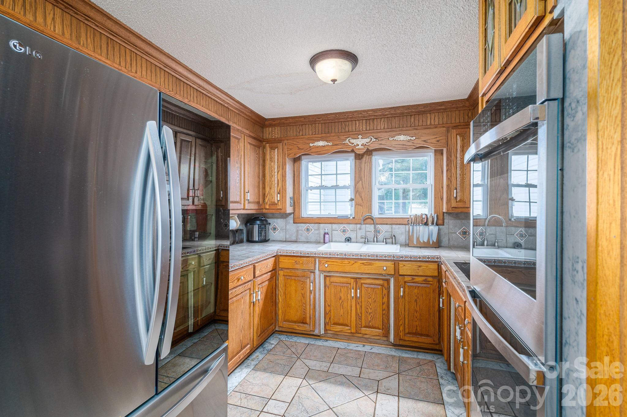 1387 George Brown Road Crouse, NC 28033 - Photo 18 of 48 a large kitchen with a sink and cabinets