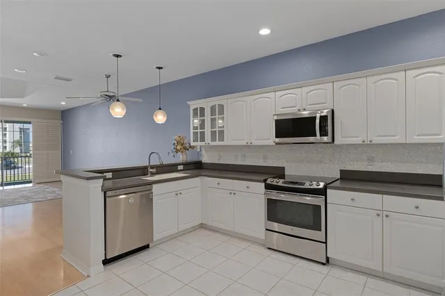 a bathroom with a sink toilet tub and shower