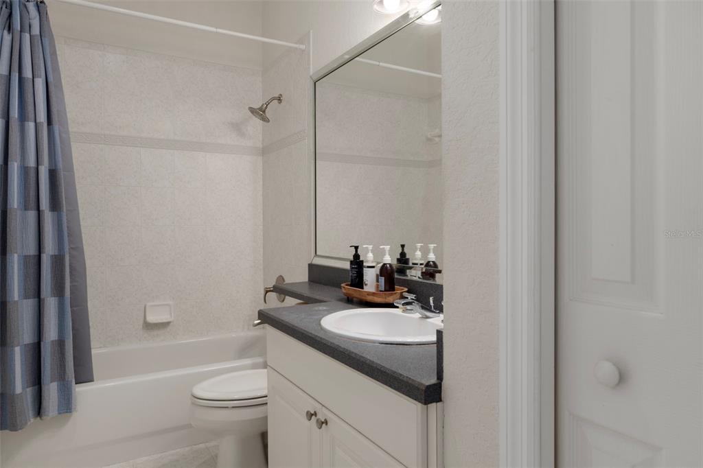 8304 Aquila Street Port Richey, FL 34668 - Photo 22 of 65 a bathroom with a sink toilet tub and shower